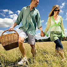 Image of a man and woman with a picnic basket